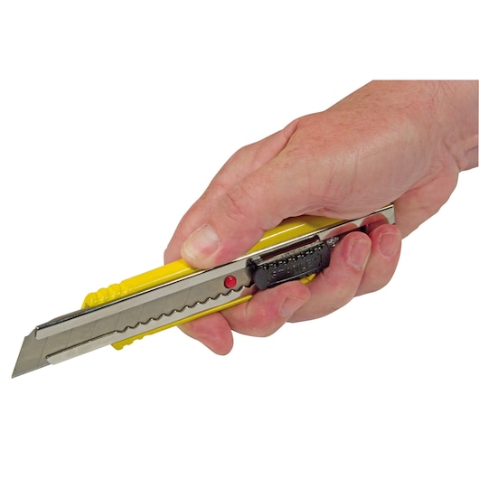 Photo of STANLEY 0-10-421 utility knife with yellow handle held in a hand, side angle.
