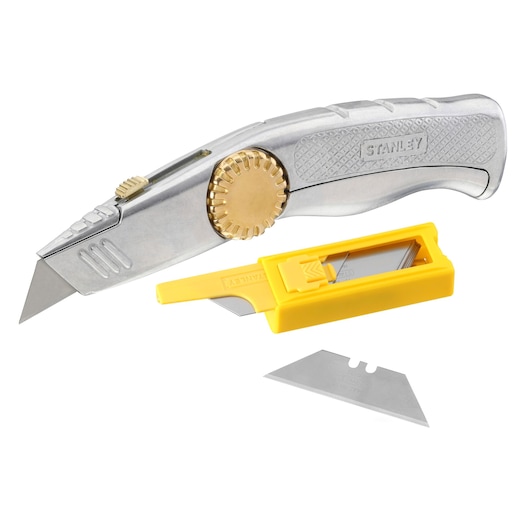 STANLEY 0-10-819 utility knife with metal body, gold adjustment wheel, spare blade dispenser, and extra blade, side angle.