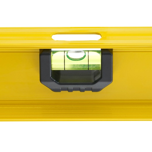 STANLEY 0-42-074 spirit level close-up, yellow body with horizontal vial, white background.