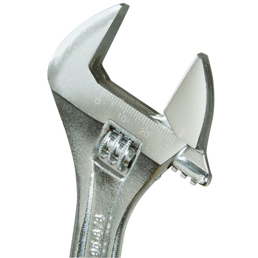 Close-up of a silver adjustable wrench with a measurement scale on its jaw.