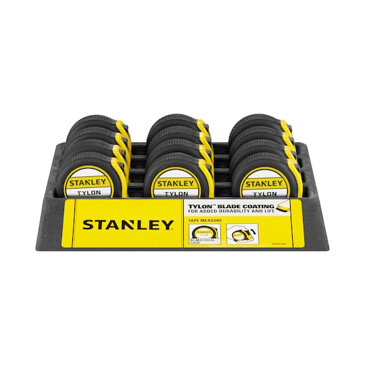 Stanley Tylon tape measures in a yellow and black display tray, arranged in three rows.