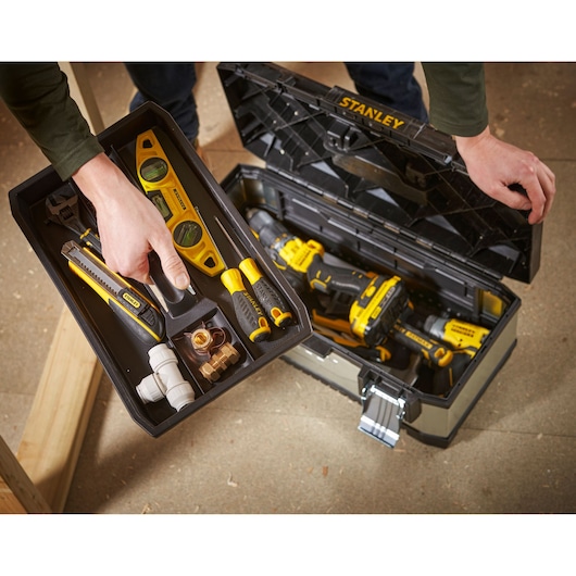 STANLEY 1-95-619 tool box photography showing hand holding tray with various tools and accessories.