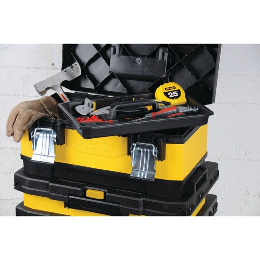 STANLEY 1-95-621 yellow toolbox with tray, tools, gloves, and tape measure, photography from front angle.