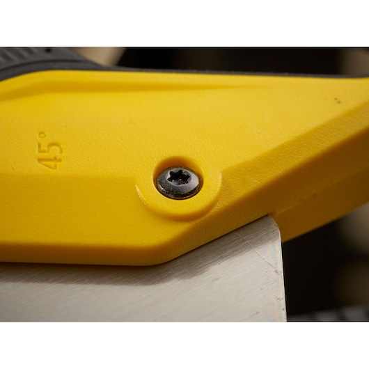 STANLEY 2-15-599 photography of yellow tool handle and metal blade at 45 degree angle, close-up view.