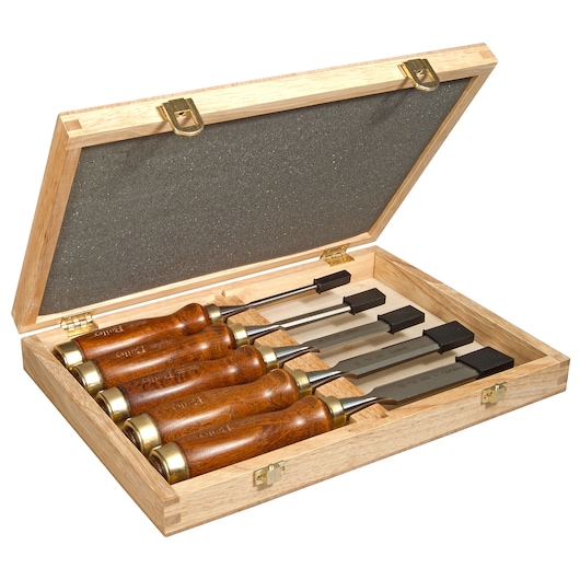 STANLEY 2-16-217 wood chisel set in wooden case, five chisels with polished wood handles, angled top view.