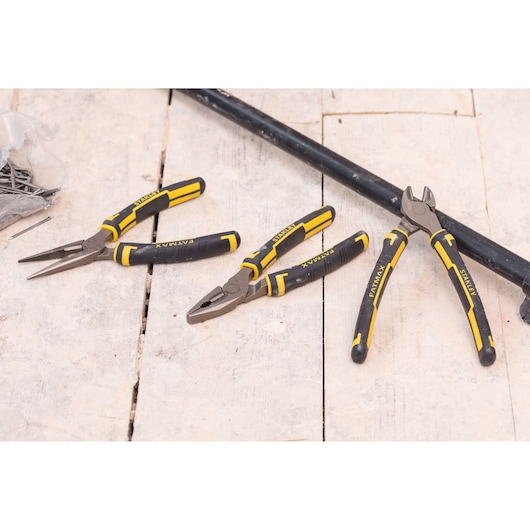 STANLEY 4-84-488 photography of three pliers with black and yellow handles on a wooden surface.