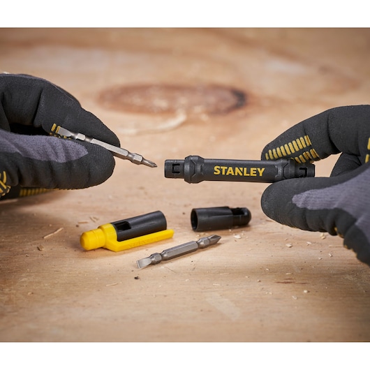 Photo of STANLEY 66-344M multi-bit screwdriver set with bits and holders shown on a wooden surface.