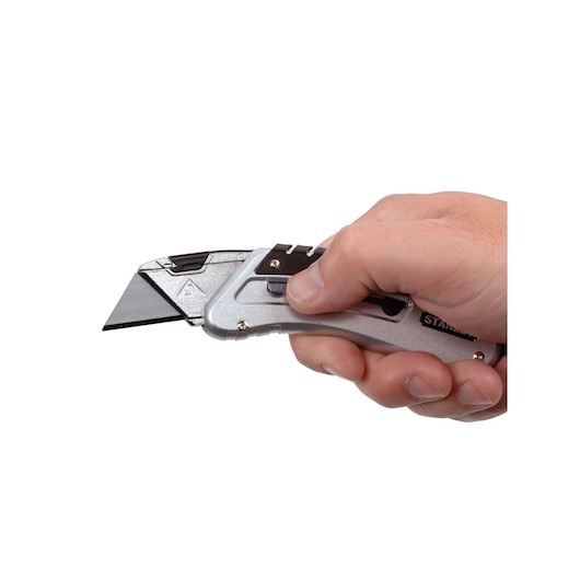 Photo of STANLEY 9-10-810 utility knife held in hand, silver metal body, angled blade, white background.