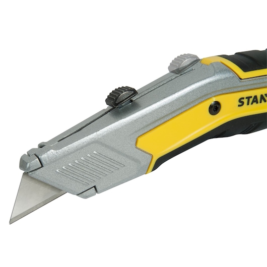 STANLEY FMHT0-10288 utility knife, silver and yellow, angled side view on white background.