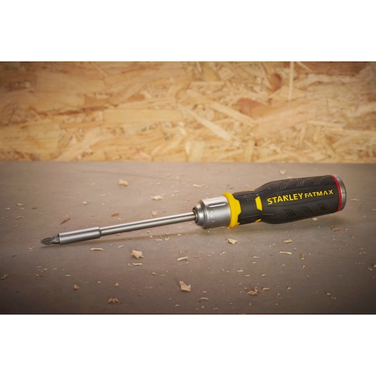 STANLEY FMHT0-62690 FATMAX screwdriver with black and yellow handle on workshop surface.
