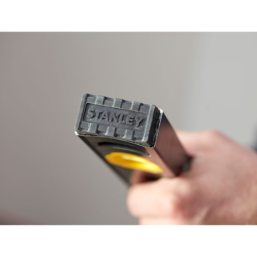 STANLEY FMHT42560-1 level close-up, showing branded end cap and yellow accents, product in hand.