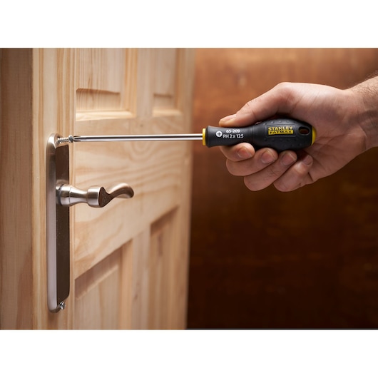 Photo of STANLEY FMHT65426-0 screwdriver being used to install a screw in a door handle.