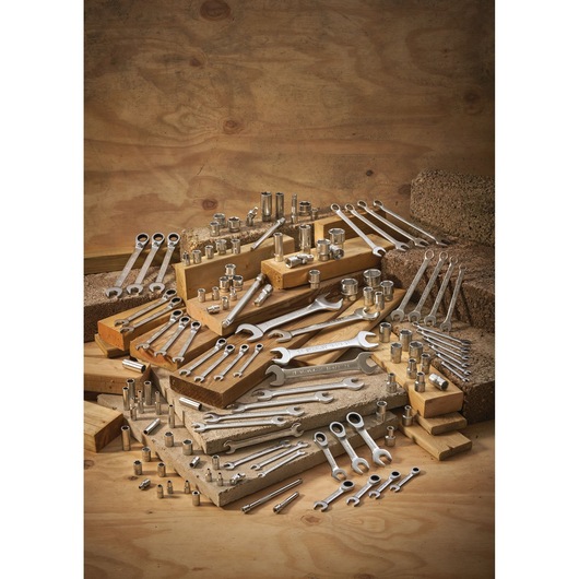 STANLEY FMMT13082-0 assorted wrenches and sockets displayed on wood blocks, workshop photography.