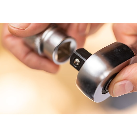 STANLEY FMMT17220-0 socket wrench close-up held by hand, showing metal and textured handle.