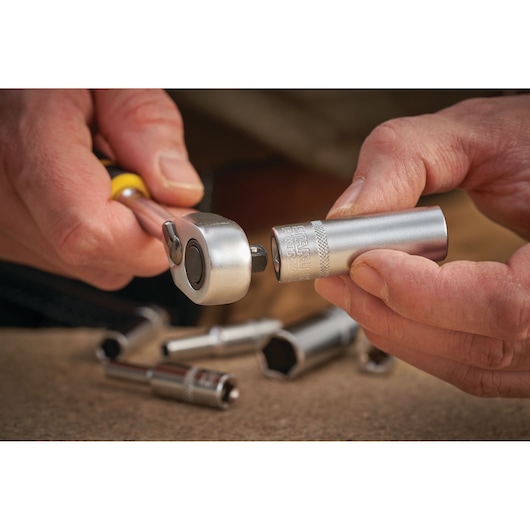 STANLEY FMMT17248-0 socket being attached to ratchet wrench, close-up, silver tool on work surface.