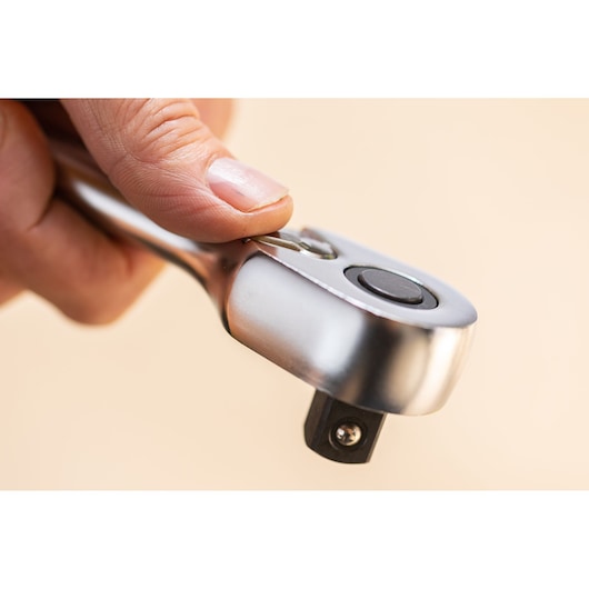 STANLEY FMMT82685-1 ratchet wrench close-up held by hand, showing metal finish and release button.