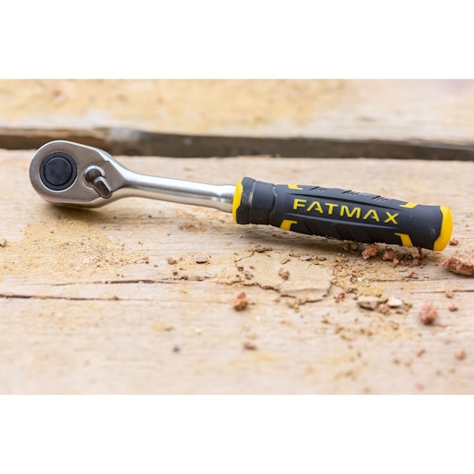 STANLEY FMMT82826-1 ratchet wrench with black and yellow FATMAX handle on a wooden surface.