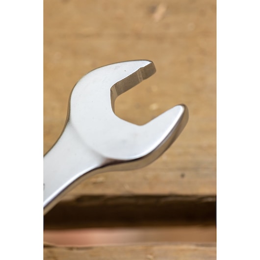 STANLEY FMMT82844-0 open-end wrench close-up on wood surface, product photography.