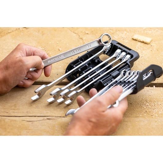 STANLEY FMMT82845-0 wrench set with holder, silver wrenches in use on wooden surface.
