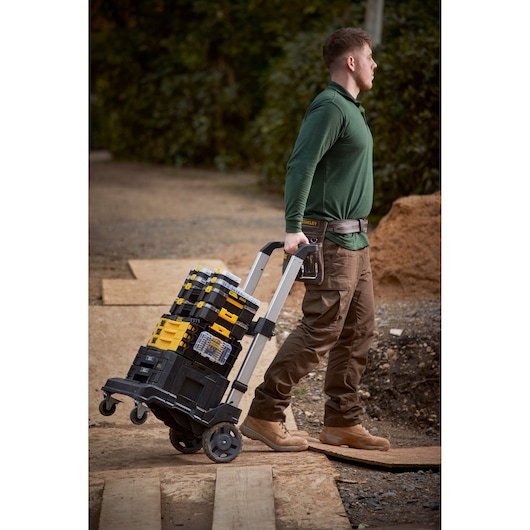 STANLEY FMMT98104-0 stackable tool boxes on wheeled cart outdoors, side angle.
