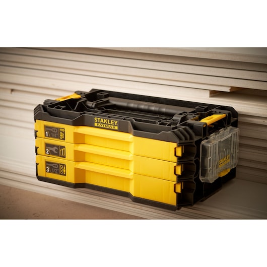 STANLEY FMMT98107-1 yellow and black tool organizer with three labeled drawers, shown from front angle.