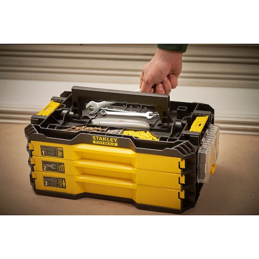 Photo of STANLEY FMMT98107-1 yellow and black tool box with handle and multiple compartments, top angle.