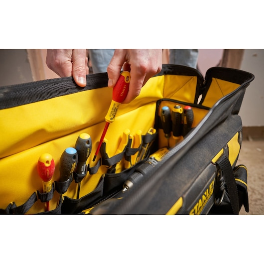 STANLEY FMST1-71180 tool bag with assorted screwdrivers in yellow and black, close-up side angle.