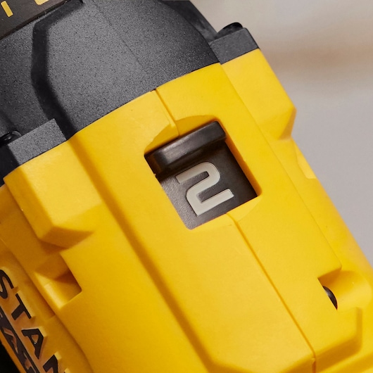 STANLEY SFMCD700C2S drill close-up showing yellow casing and visible gear switch set to 2.