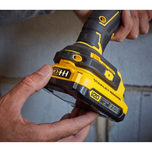 Photo of STANLEY SFMCD715D2F cordless drill close-up, yellow and black with V20 2.0Ah lithium-ion battery.