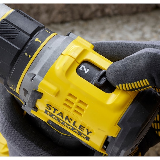 STANLEY SFMCD721D2K yellow cordless drill close-up with gear switch and FATMAX logo visible.