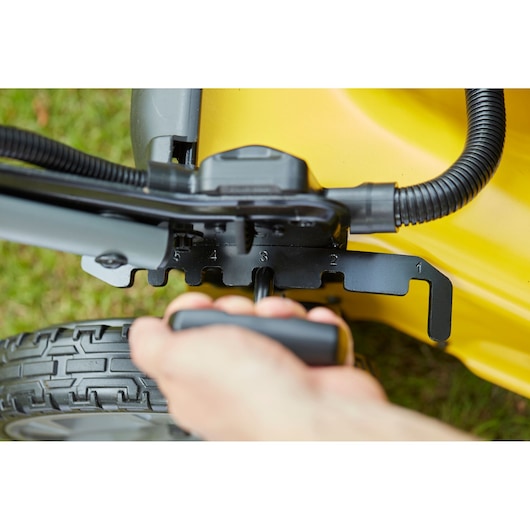 STANLEY SFMCMS2653B lawn mower height adjustment handle in close-up with numbered settings.