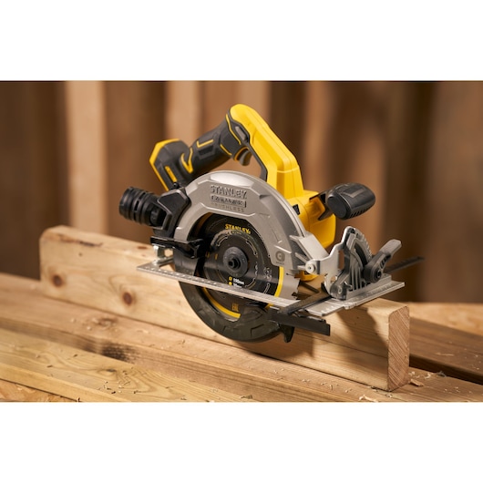 STANLEY SFMCS550M2K cordless circular saw with brushless motor cutting wood, side angle view.