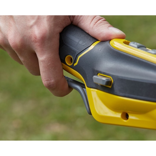 Photo of STANLEY SFMCSTB963B trimmer handle grip and trigger, close-up detail.