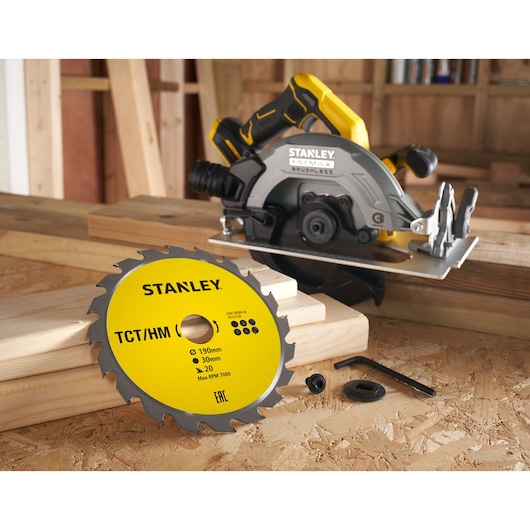 STANLEY STA13030 circular saw and yellow TCT/HM blade on wooden boards, side angle view.