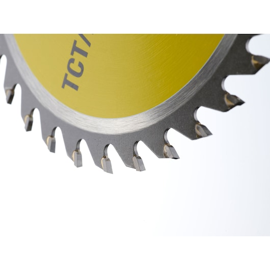STANLEY STA13060 circular saw blade close-up, yellow center, sharp metal teeth, photography with white background.