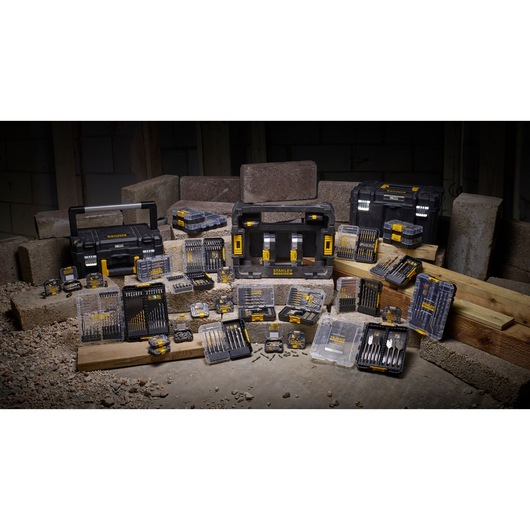 STANLEY STA88567 photography of assorted drill bit sets, toolboxes, and cases displayed on construction site.