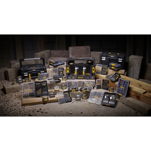 STANLEY STA88569 photography of assorted drill bit sets and toolboxes displayed on construction materials.