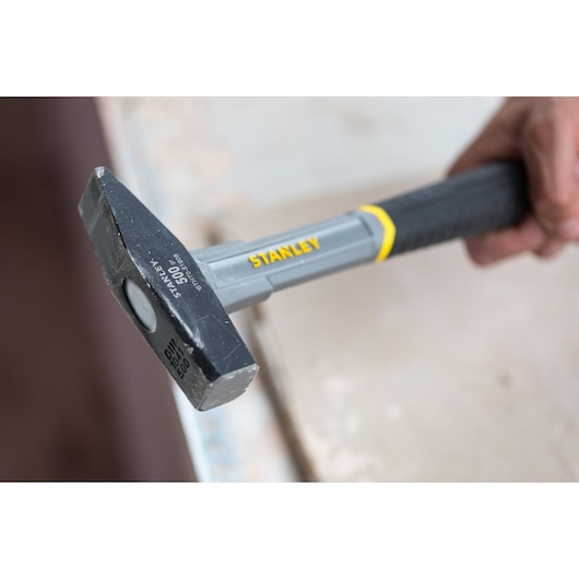Stanley STHT0-51908 club hammer with gray and black handle in close-up photography.