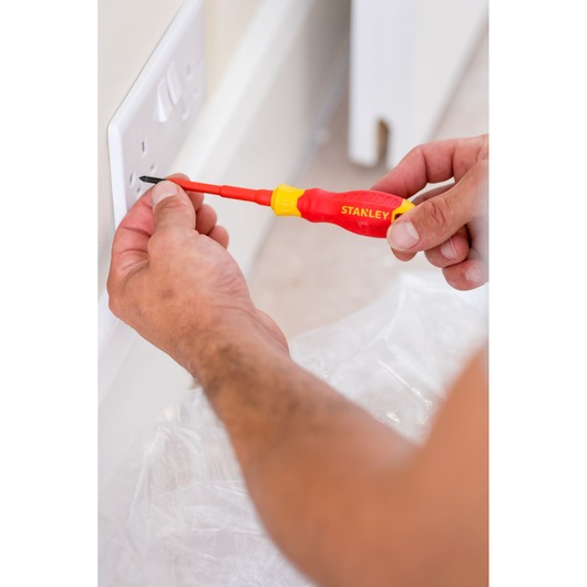 Photo of STANLEY STHT60031-0 insulated screwdriver used to install a wall power socket.
