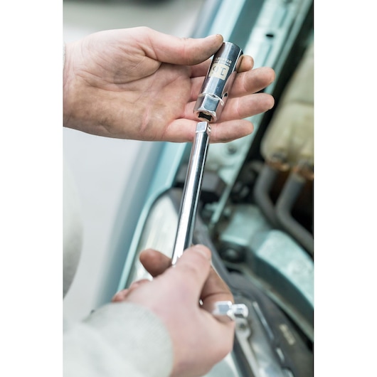 Photo of STANLEY STHT81583-0 socket wrench in use near car engine.