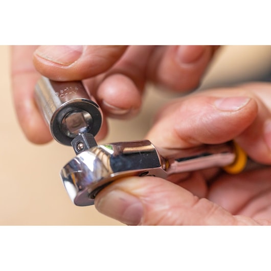STANLEY STMT86109-0 close-up photo of ratchet wrench and socket being assembled by hand.