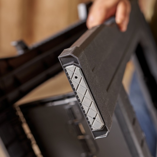 STANLEY STST1-70713 storage box reinforced edge, close up, black and grey plastic construction.