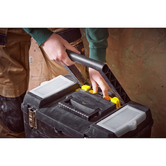 STANLEY STST1-75758 toolbox with handle and organizer compartments, close-up in use.
