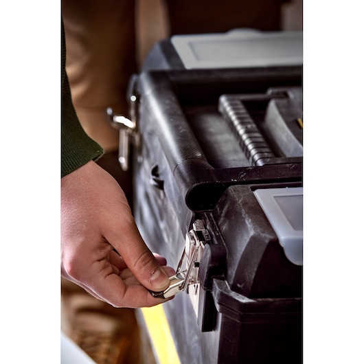 STANLEY STST1-75758 tool box close-up, black with metal lock being opened, photography category.