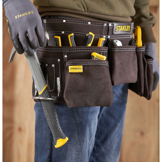 STANLEY STST1-80113 tool belt filled with hand tools, close-up view, worn by person.
