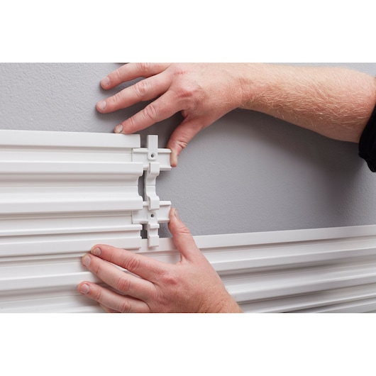 STANLEY STST82610-1 photography showing hands connecting white wall mounting rails.
