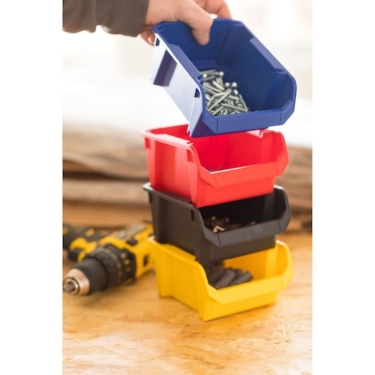 STANLEY STST82710-1 stackable plastic storage bins in blue, red, black, and yellow with hardware inside.
