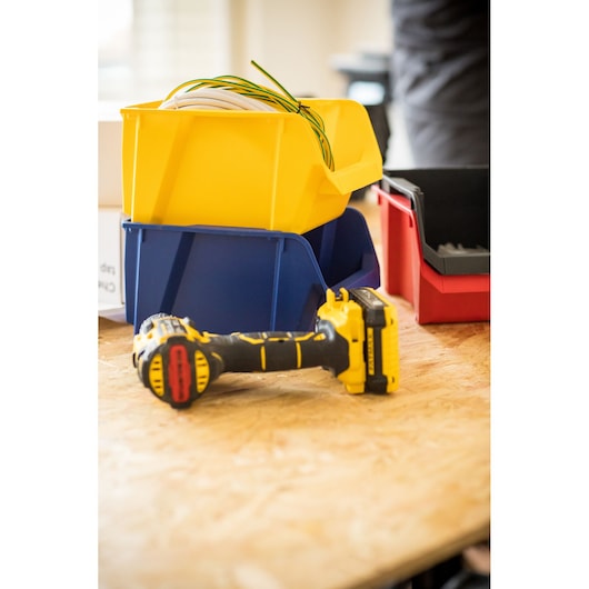 STANLEY STST82740-1 storage bins in yellow, blue, red with tools on wood surface, photography angle.