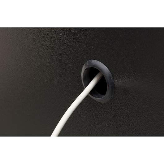 STANLEY STST97957-1 close-up photo of cable management hole with white cable, product category: photography.