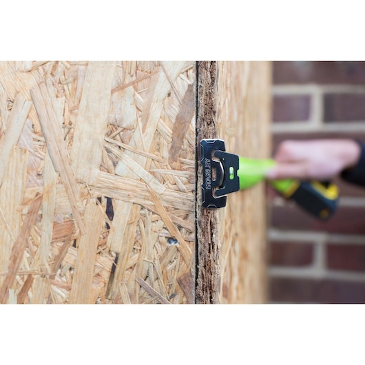 STANLEY XTHT0-36004 photography showing metal tool mounted on wooden panel, close-up view.